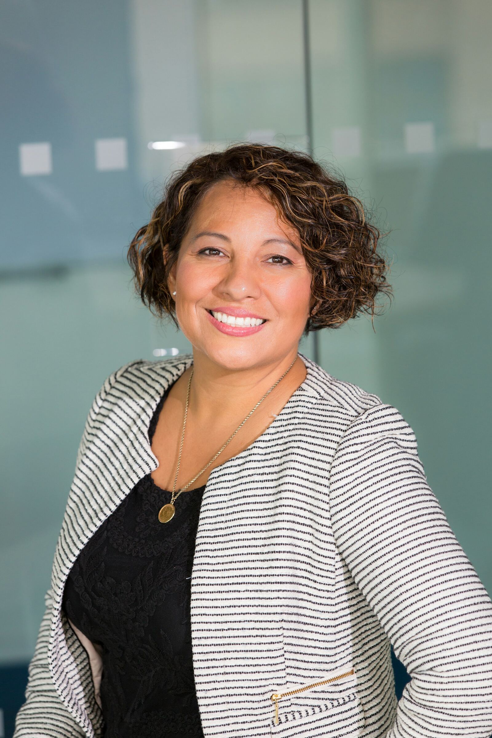 A client smiling in a bright modern office